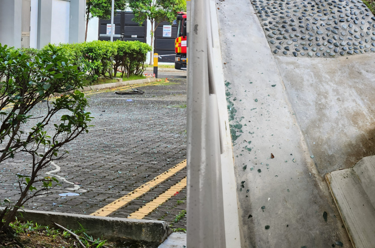 shards of broken glass litter the street below the flat (Pic source: GF Pat/Facebook)
