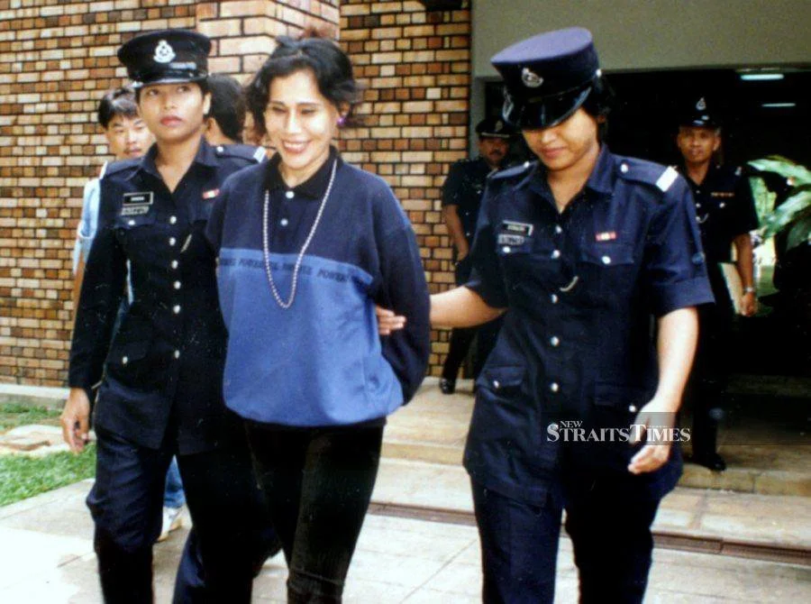 Mona Fendey arrested. Photo by New Straits Times