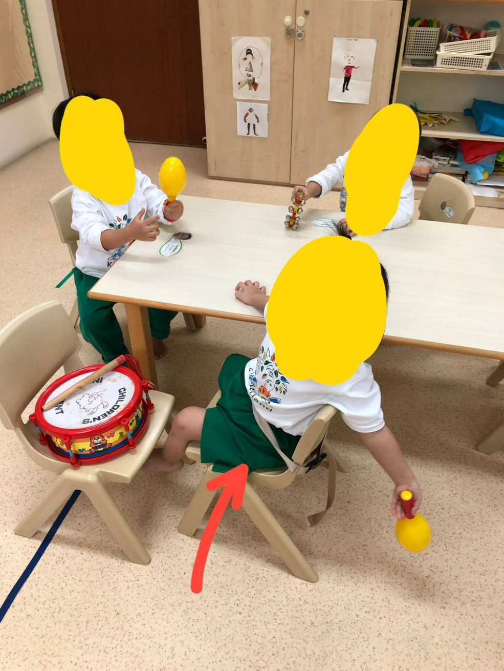 Kinderland student 'buckled' to a chair. (Photo: Mothership)