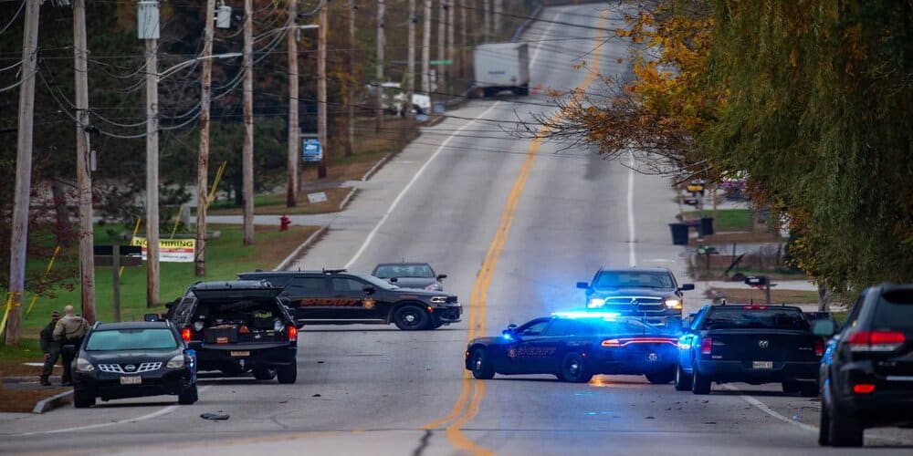 Law enforcement officers at Schemengees bar in Lewiston, Maine, where the assailant visited following a fatal shooting spree at a bowling alley. (Photo: Joseph Prezioso/AFP/Getty Images