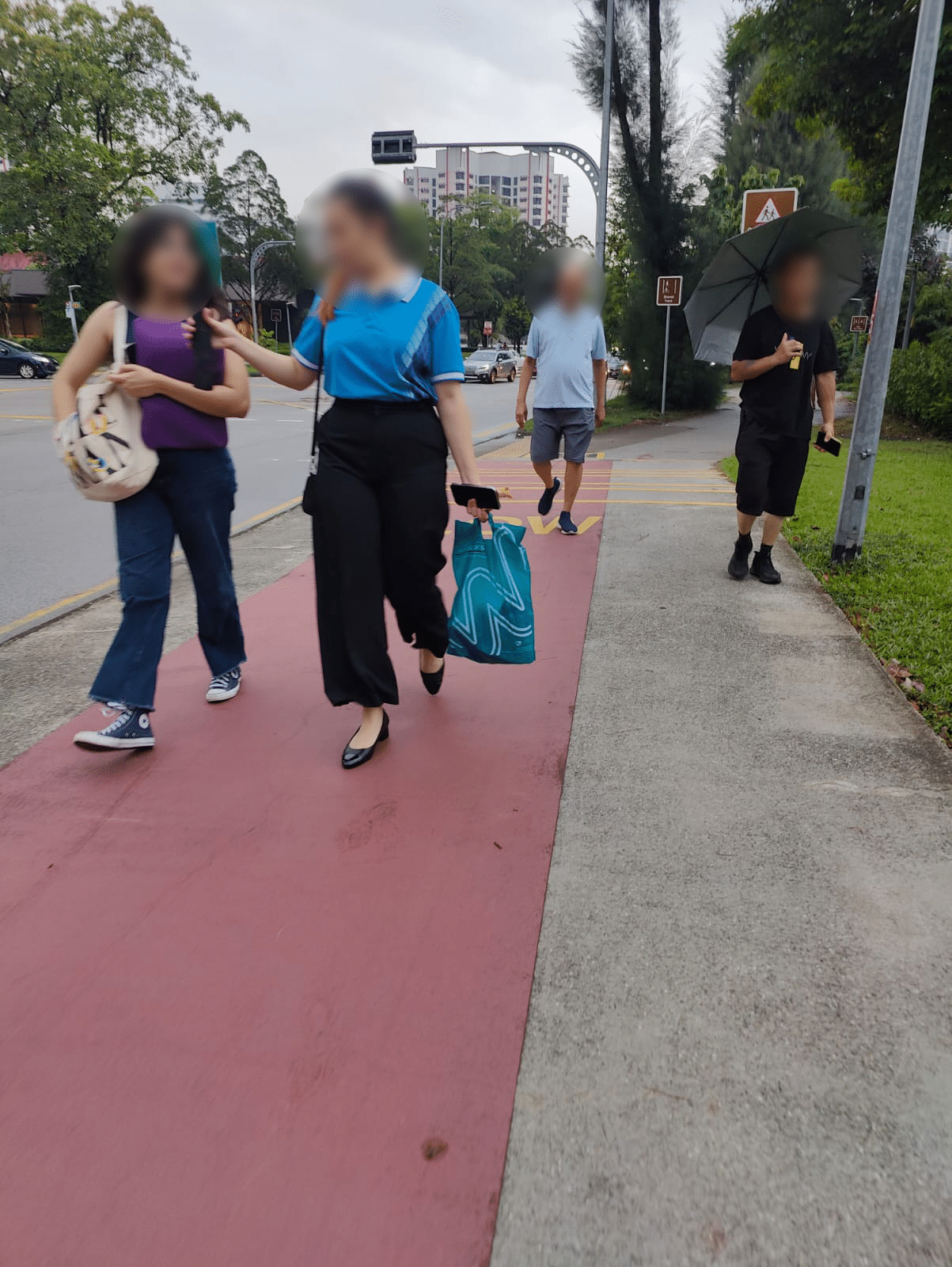 Photo of pedestrains walking on the cycling lane